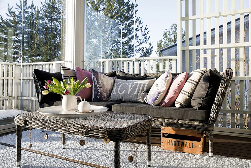 Wicker furniture fits perfectly on a Mediterranean-style veranda