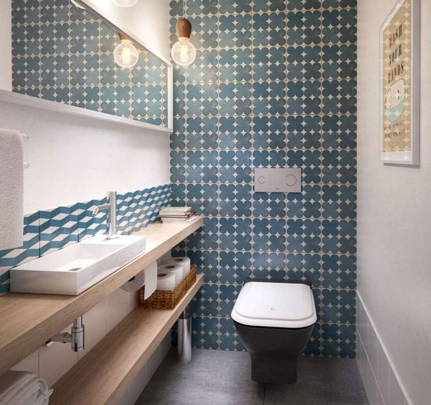 The walls and floor of the toilet are tiled