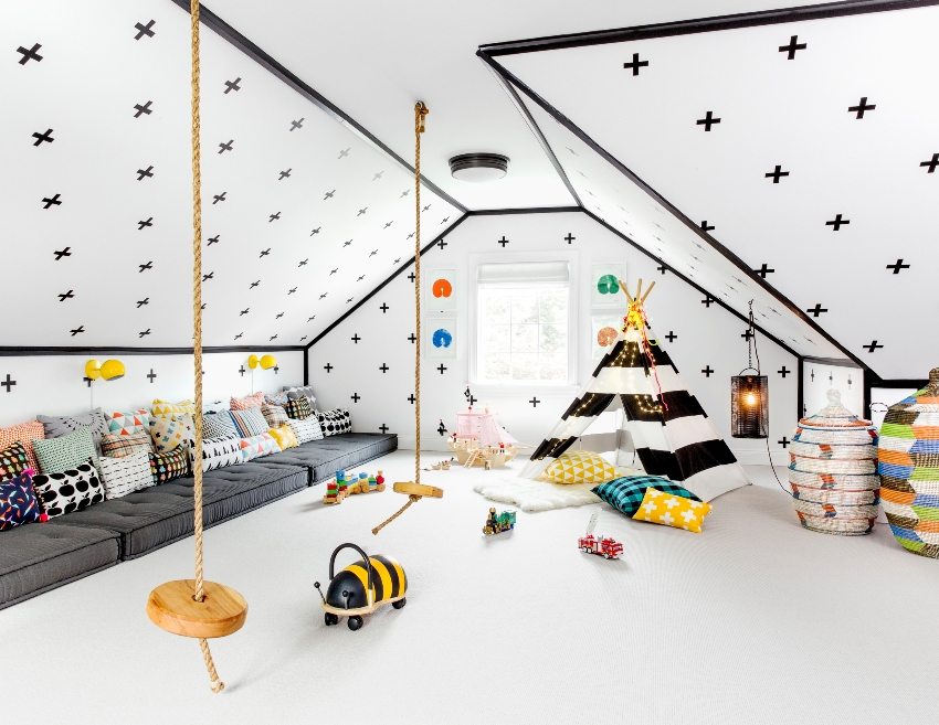 The attic room is equipped with a spacious children's playroom