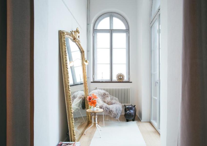 A large mirror will help to visually enlarge the room