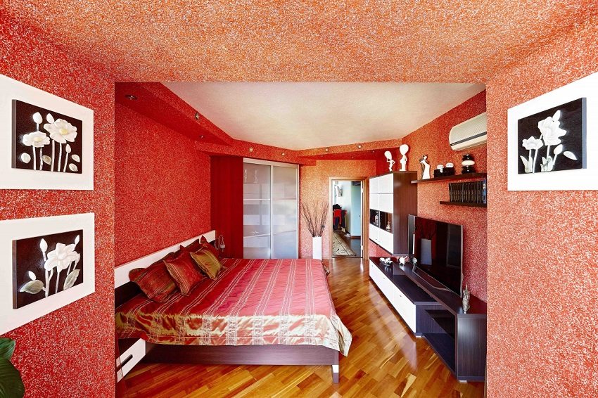 Bright red liquid wallpaper in the interior of the room