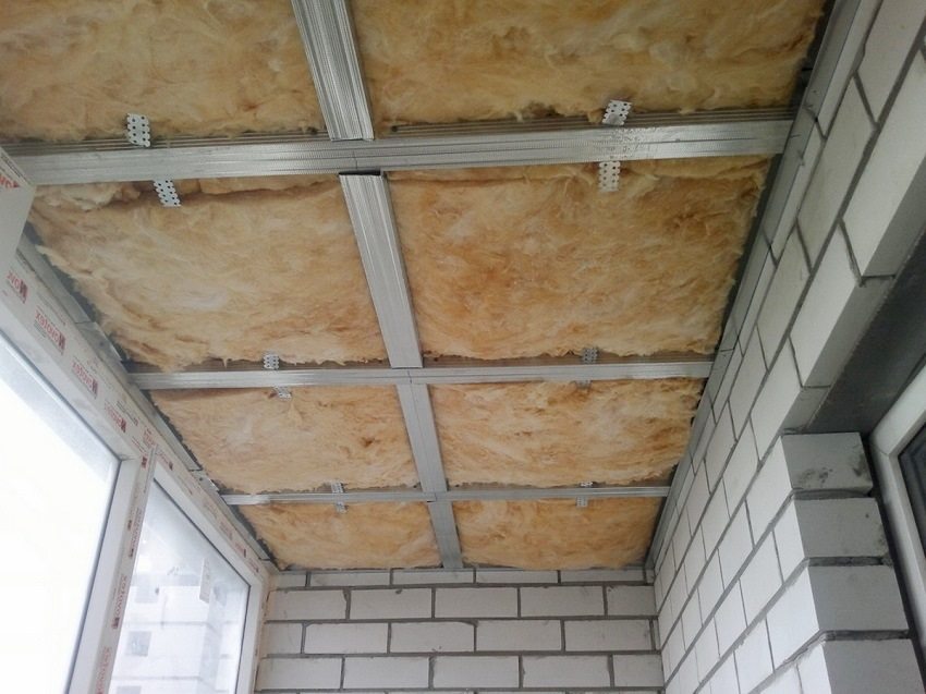Insulation is laid in the ceiling frame for subsequent sheathing