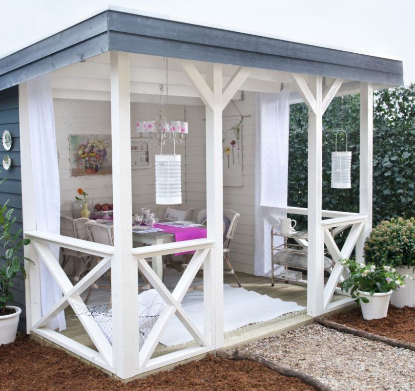 Cozy gazebo painted in contrasting colors - white and dark gray