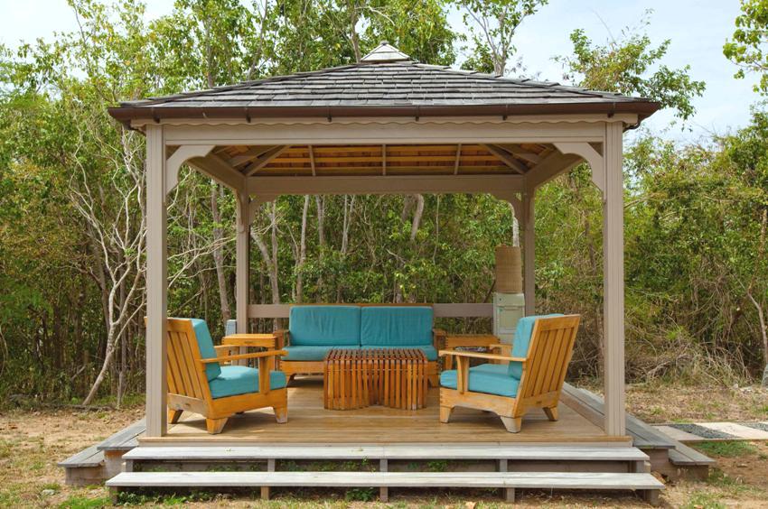 The floor of the gazebo is made of wood treated with moisture-repellent compounds