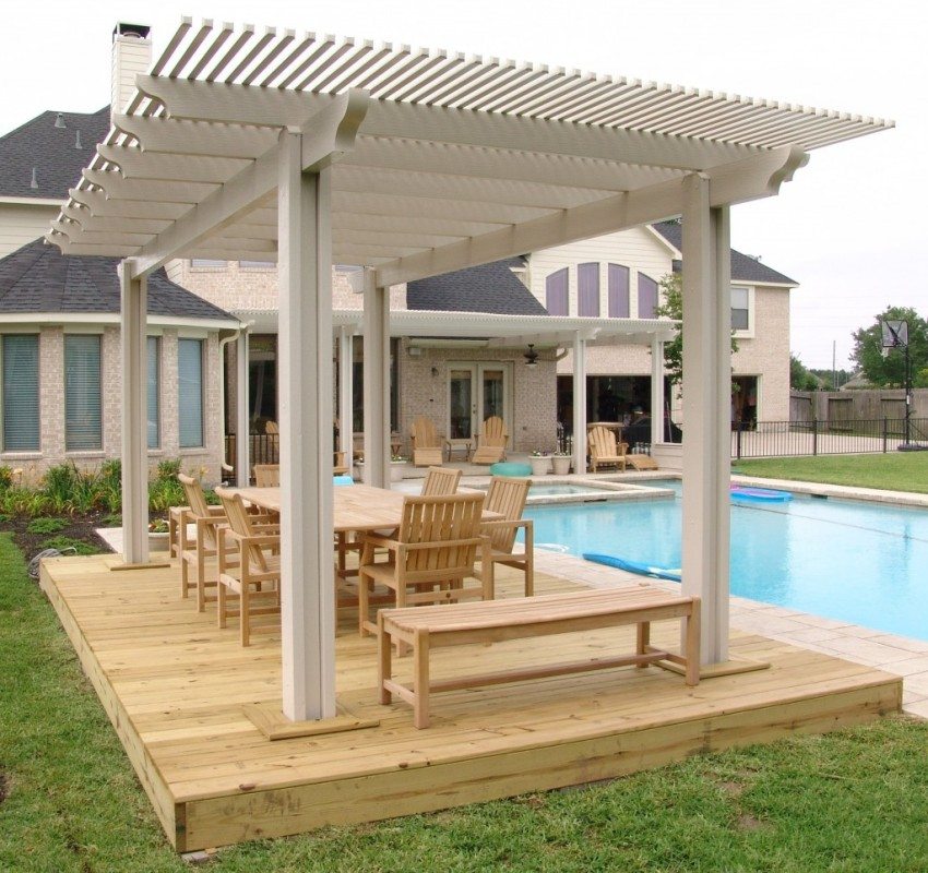 A gazebo mounted on a small wooden platform near the pool