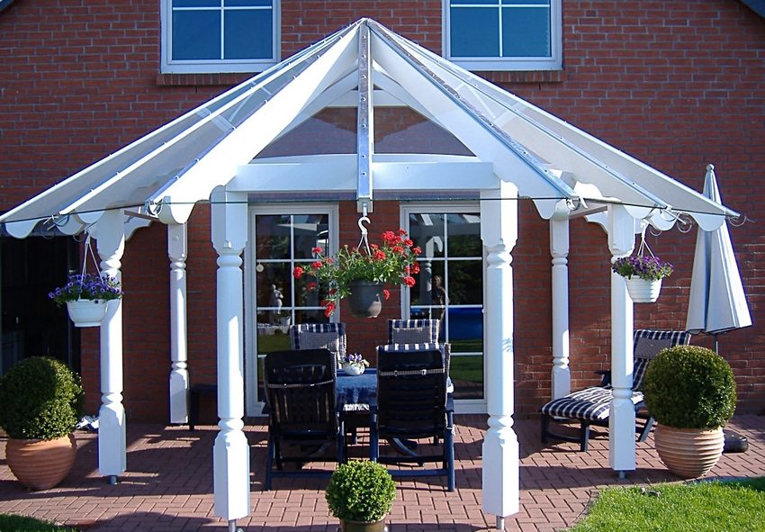 A tent-shaped canopy in the courtyard of a private house