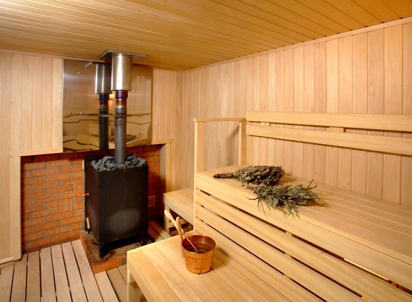 Small metal sauna stove with built-in tank