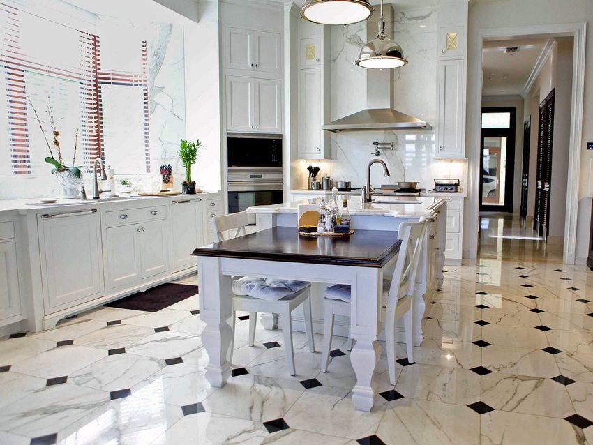 The modern kitchen interior uses floor tiles of different sizes and colors.