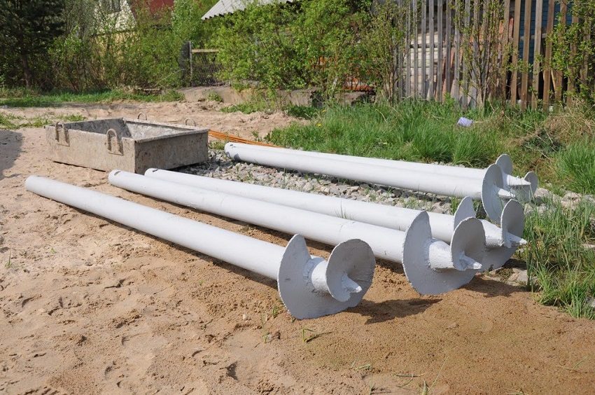 Steel pipes with tips and blades for screw pile foundations