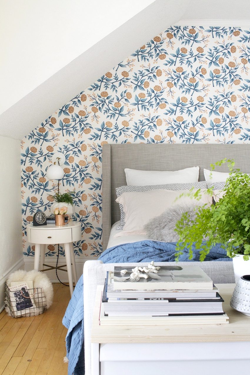 Floral ornament in the bedroom design is in good harmony with plain walls