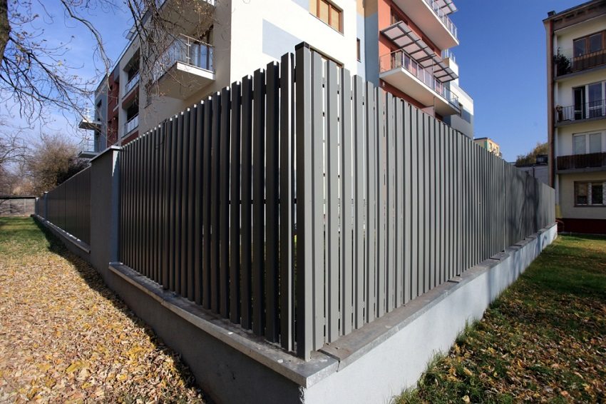 The metal picket fence is perfectly combined with other materials