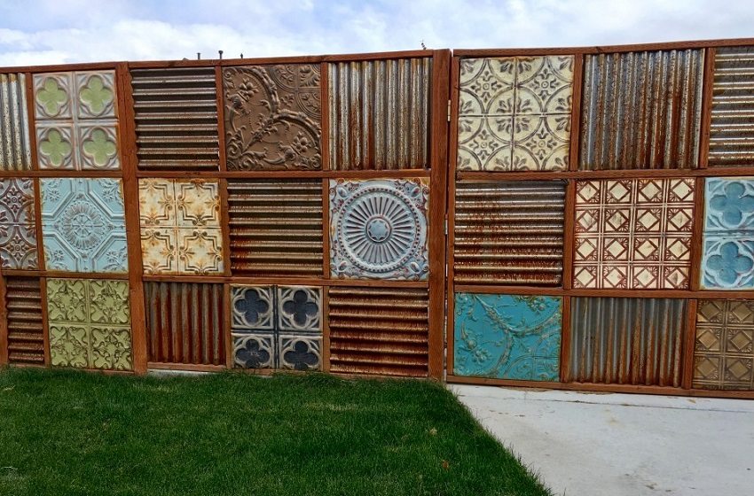 The presence of corrugated board and old tiles will help to creatively approach the construction of a fence