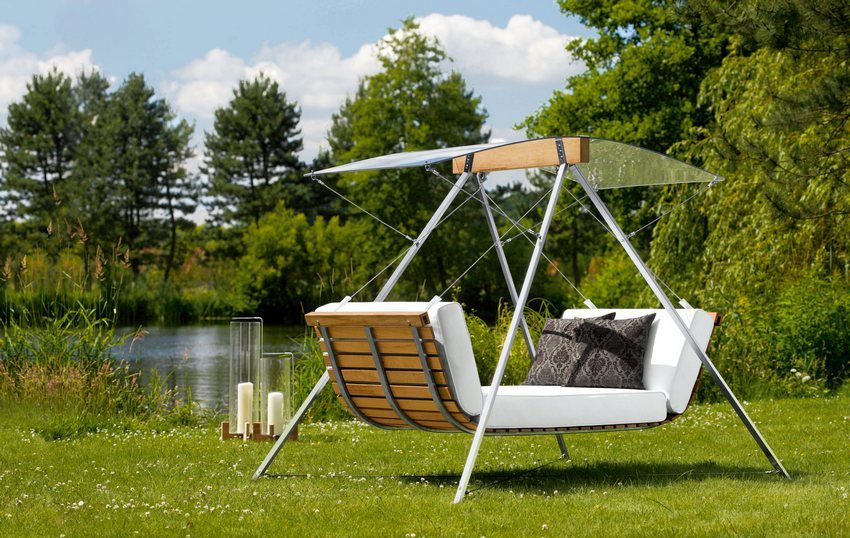 Modern design of a metal swing for a summer residence