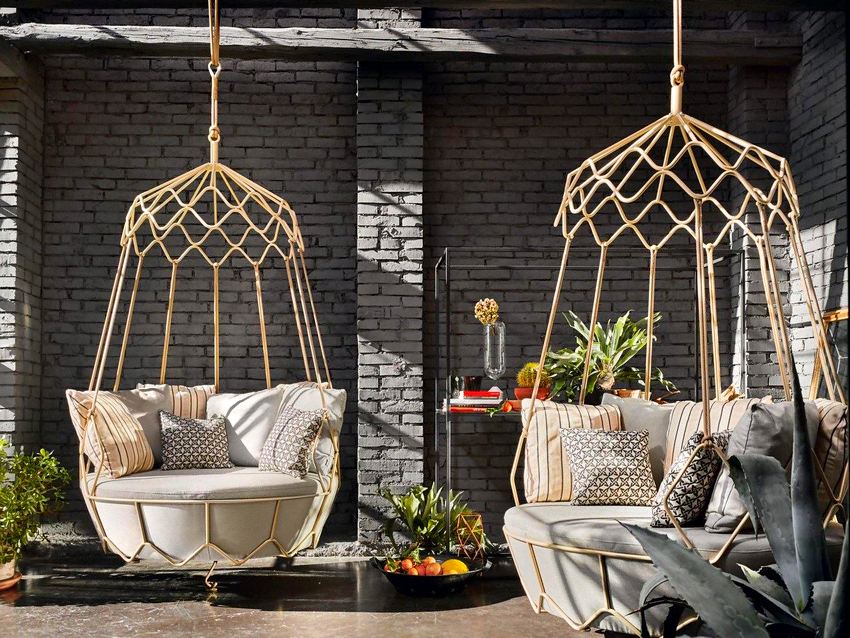 Suspended swing of unusual shape with a metal frame