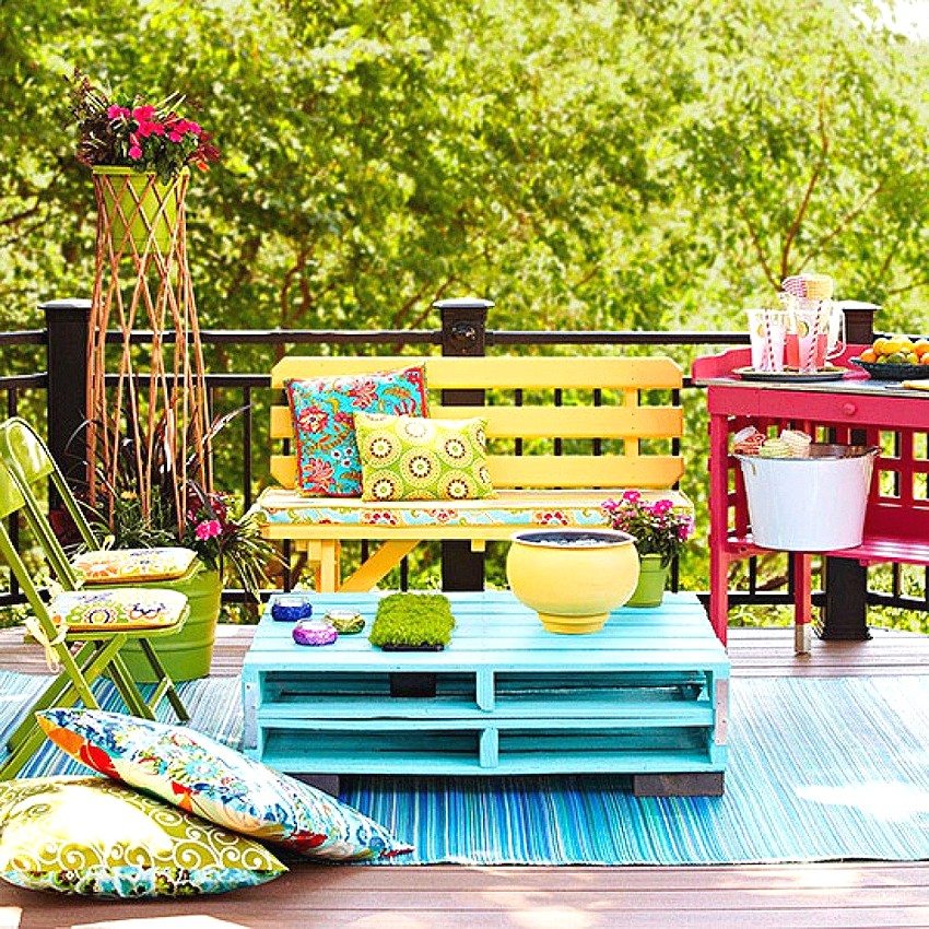 A wooden bench painted in a cheerful yellow color harmoniously fits into the overall design of the recreation area