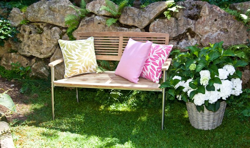 Wooden garden bench with metal frame