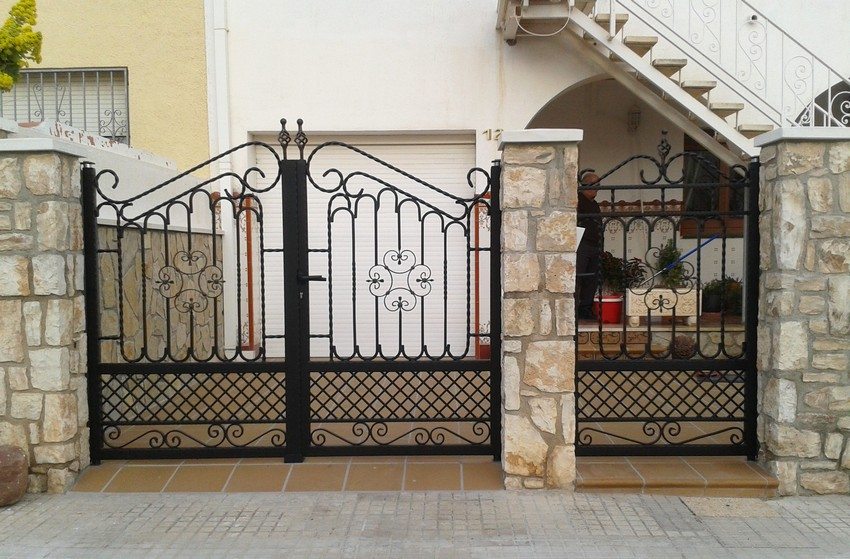Swing gates with a wicket, forged from metal, durable and environmentally friendly