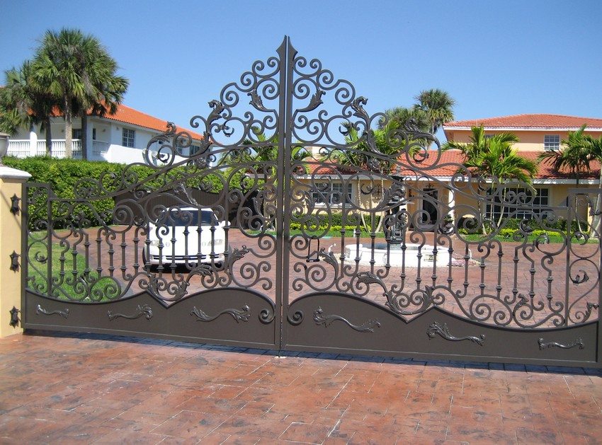 Metal swing gates with an abundance of openwork forged elements