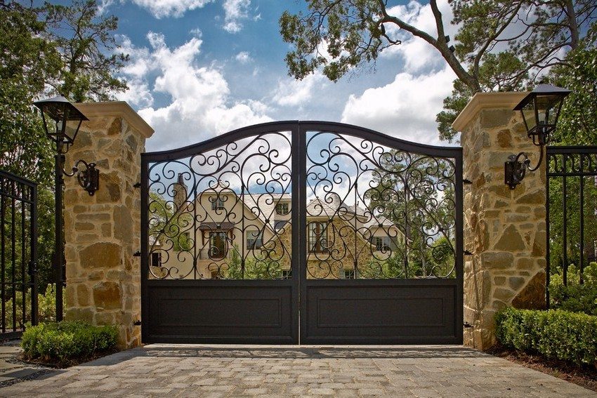 Wrought iron gates and wickets look elegant and luxurious