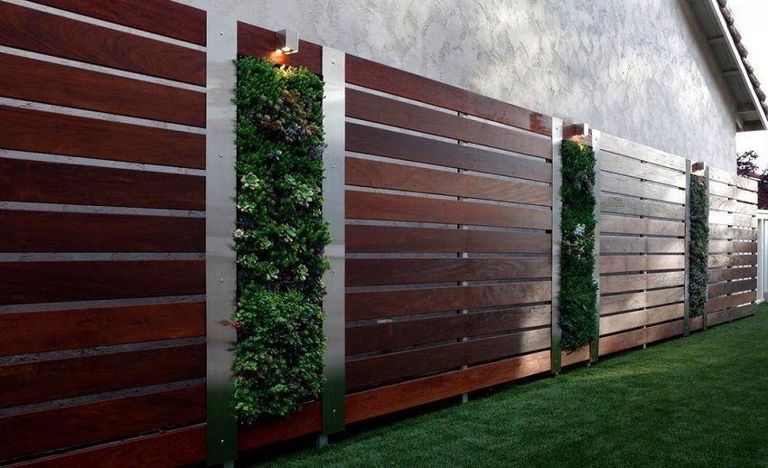 Using various materials, you can get a modern fence on a metal base