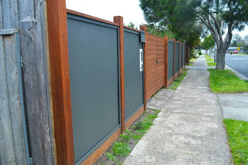 Fence made of profiled sheet with a low wave height and a wooden frame