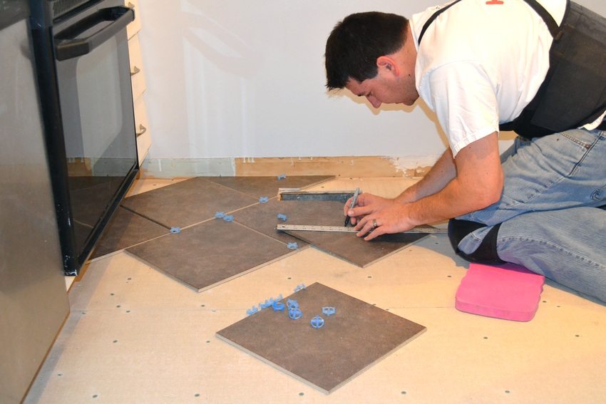 Various materials are used to level the floor before laying the tiles, for example, fiberboard