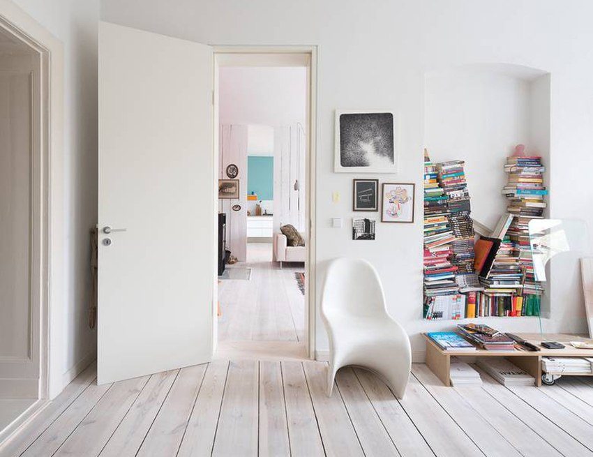 Laconic combination of light laminate with a white door