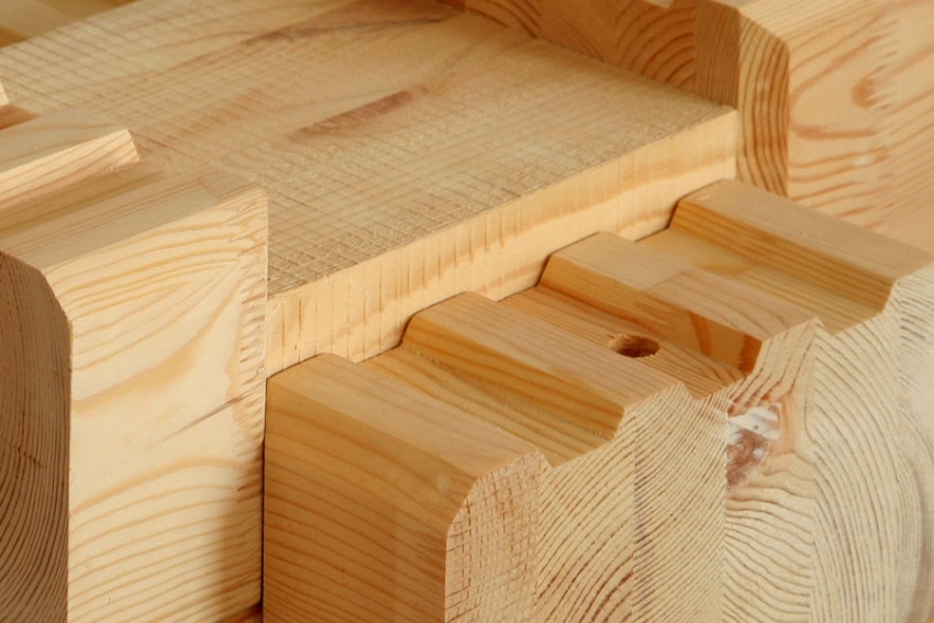 Logs with ready-made grooves can be purchased from a timber manufacturer for building a house.