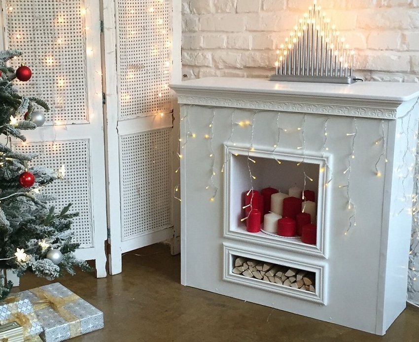 An imitation fireplace made of cardboard and plastic