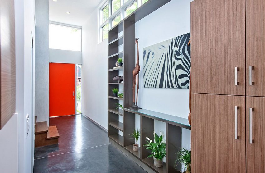 Bright and bold colors can bring variety and originality to a small room in the corridor.