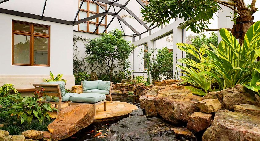 A winter garden in a private house is a special corner where various indoor plants are placed, creating a special atmosphere