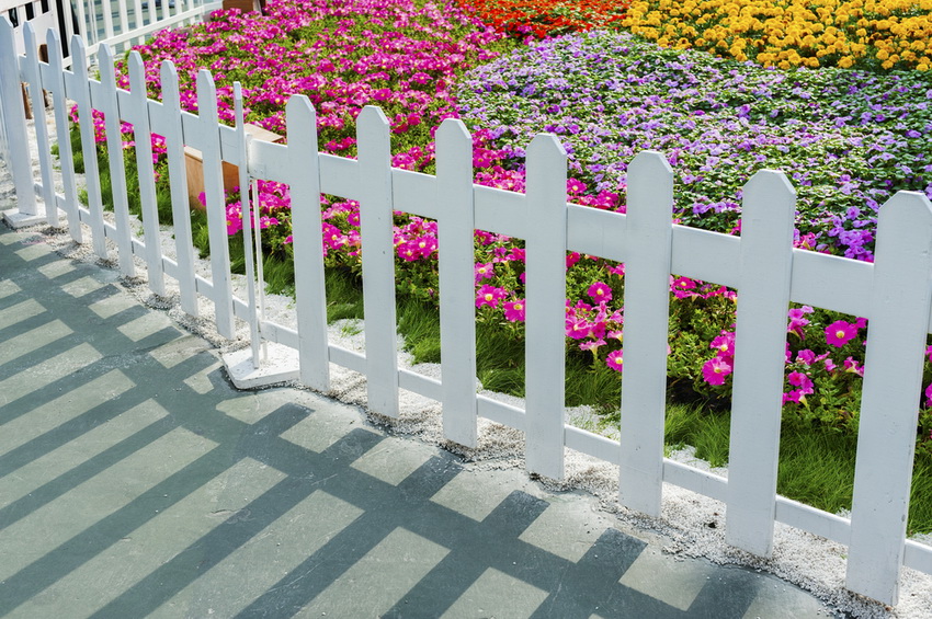 A simple and elegant version of a decorative fence - a white picket fence