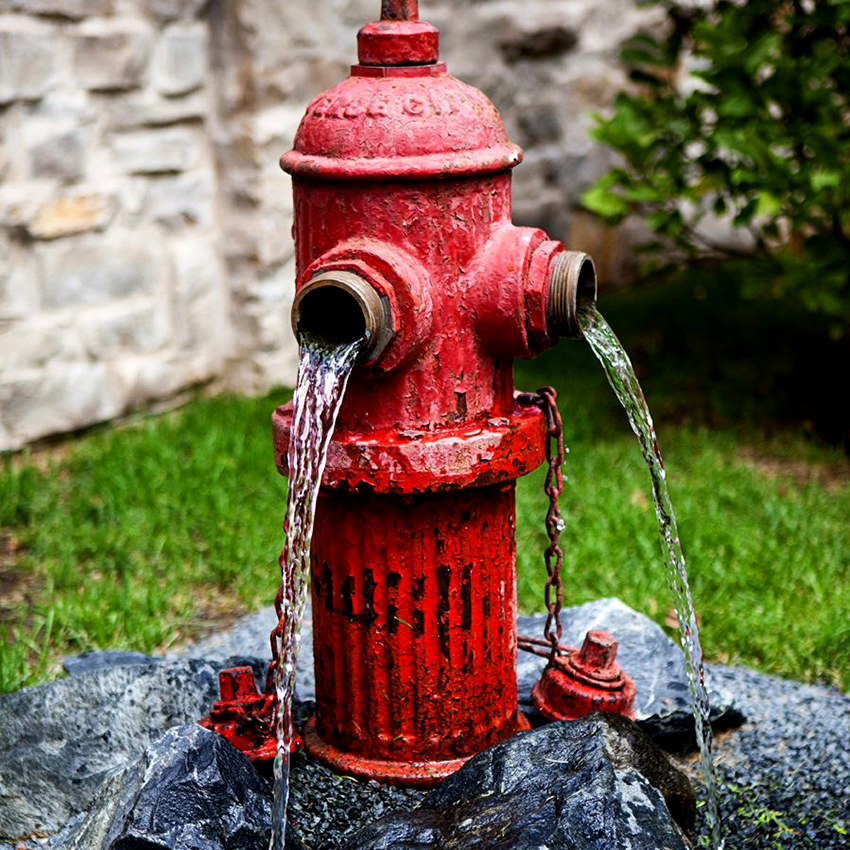A fountain made from an old fire hydrant will look original