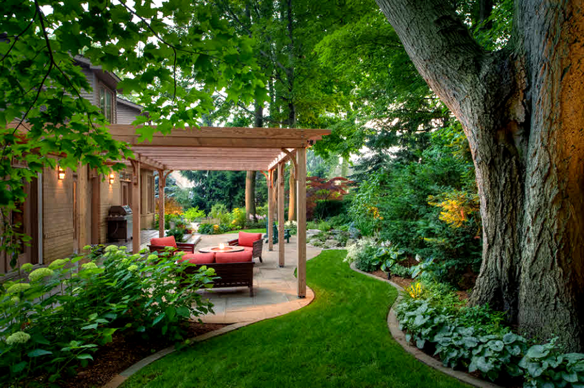 With the help of a canopy pergola, you can make a cozy terrace near the house