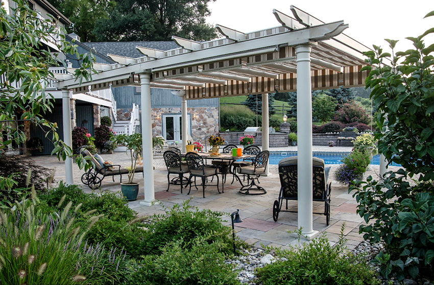 The covering of the pergola-awning is chosen based on the general color scheme of the landscape design
