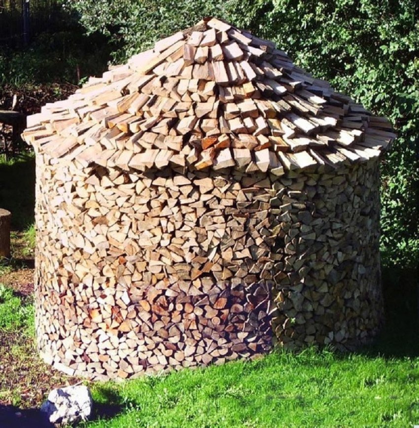 The base of the round woodpile is laid out in a ring