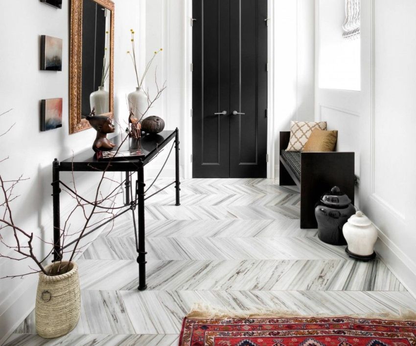 You can visually enlarge the hallway using a diagonal pattern on the floor.
