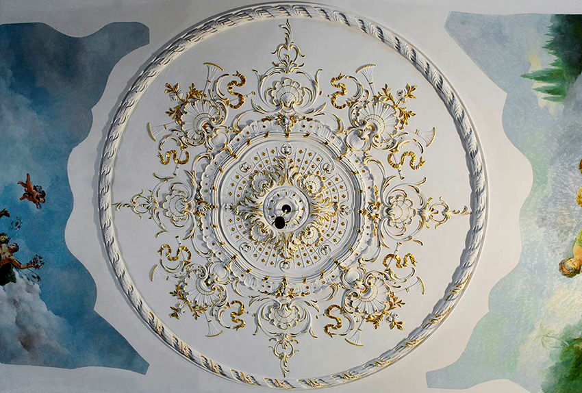 Most often, gypsum rosettes are used in the decoration of holes for placing a chandelier.