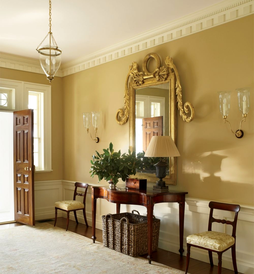 Large mirror in an original frame - an elegant addition to the design of a beautiful hallway