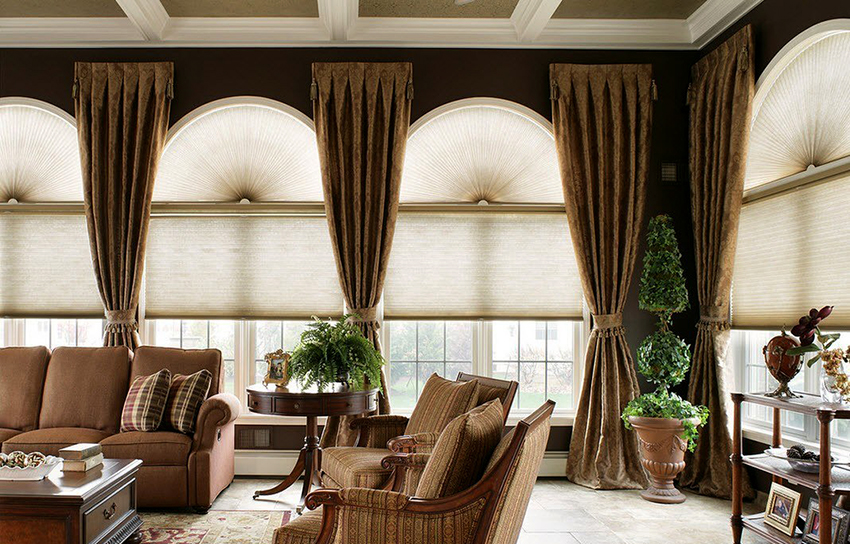 Classic-style curtains are decorated with frills, tiebacks, edging and lambrequins