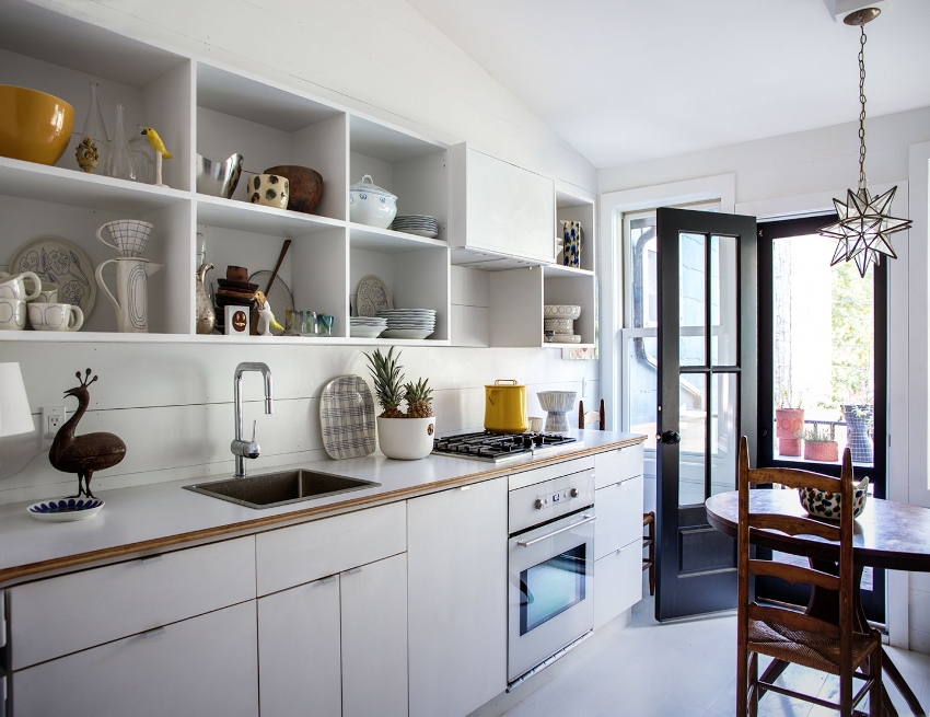Open cabinets provide quick and easy access to kitchen utensils