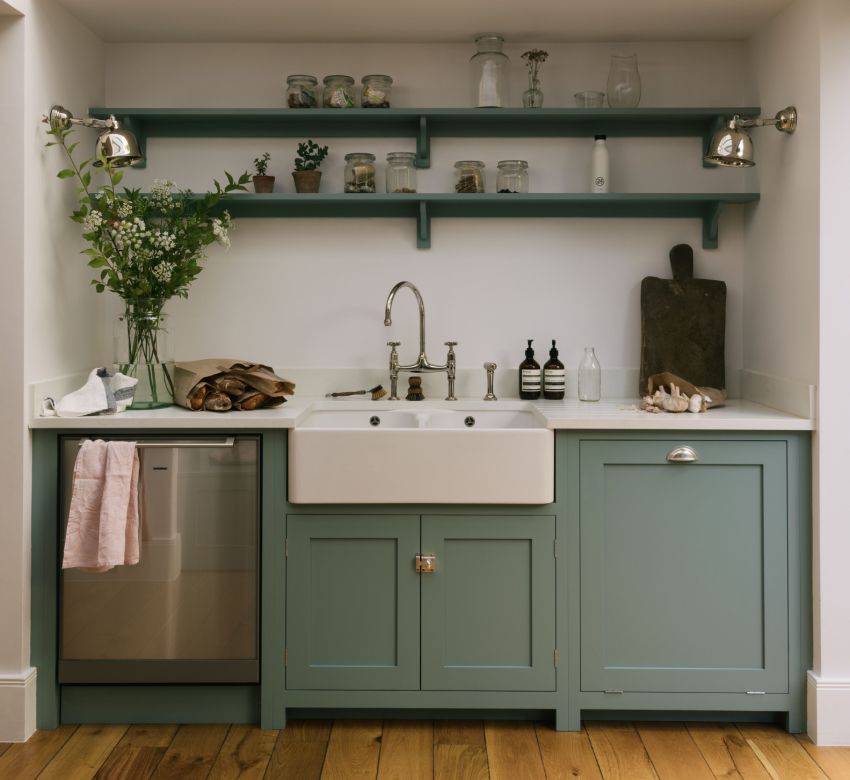 In order not to clutter up the space of a small kitchen, instead of hanging cabinets, you can equip open light shelves