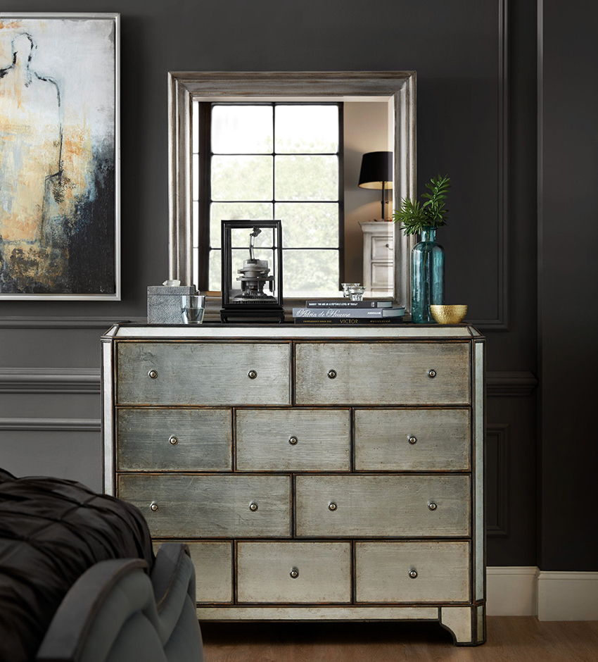 A chest of drawers with a mirror is a multifunctional piece of furniture