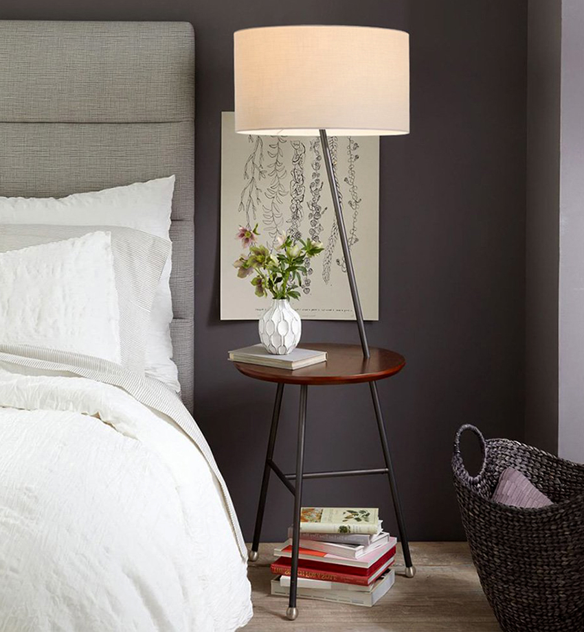 A floor lamp with a table can easily replace a bedside table and lamp
