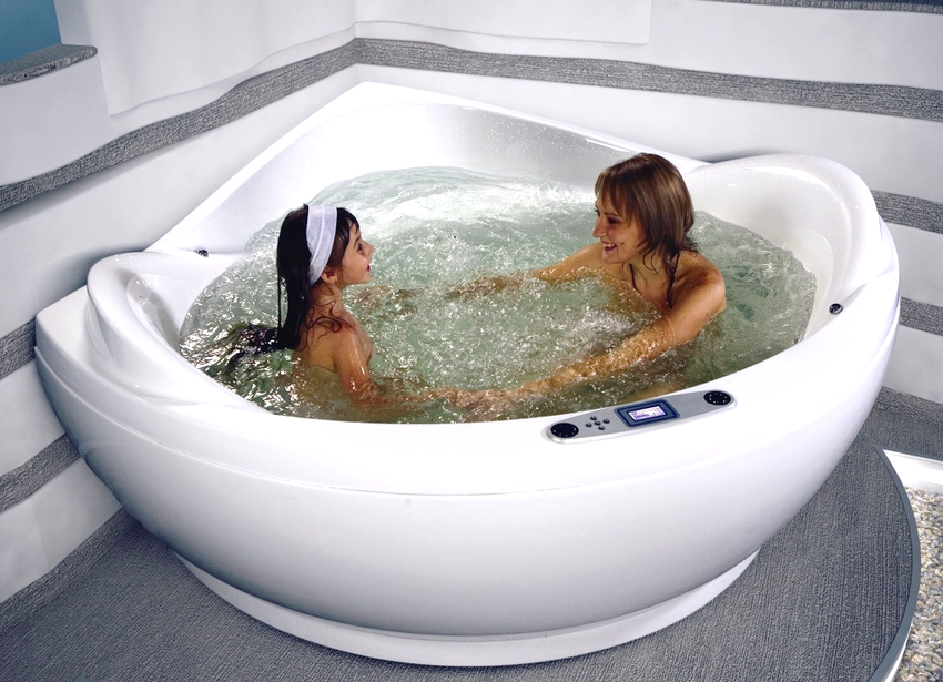 For a small bathroom, it is better to purchase a corner bath with hydromassage