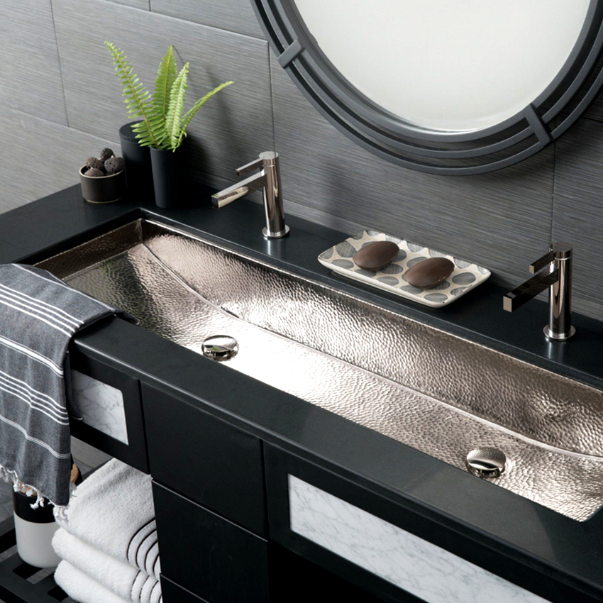 Built-in sinks have two types of installation: with partial sinking of the bowl and placement under the countertop