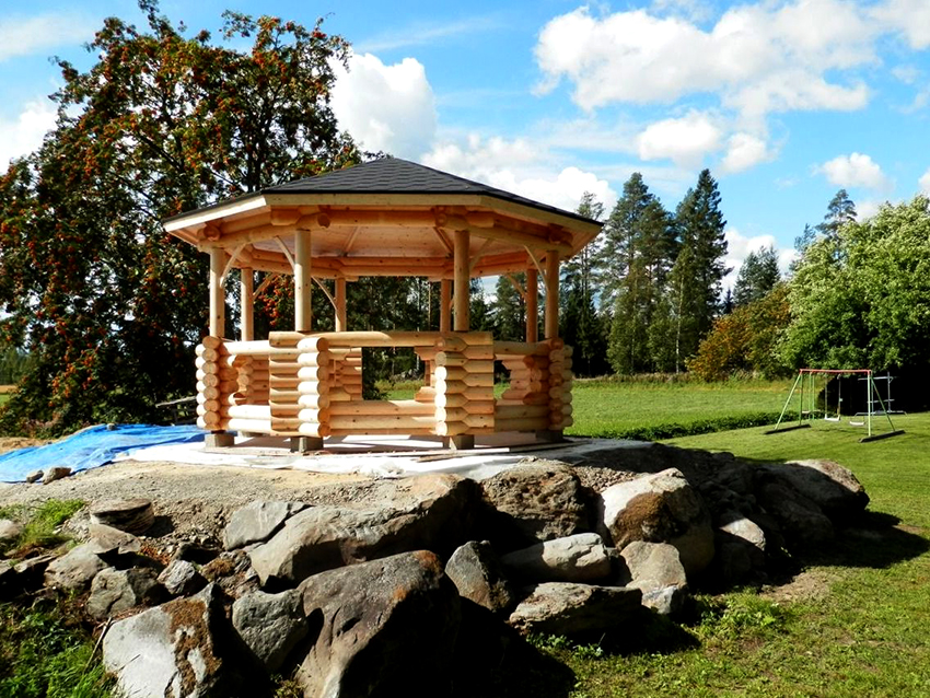 It will be convenient and cozy to spend time with friends or family in a gazebo made of logs