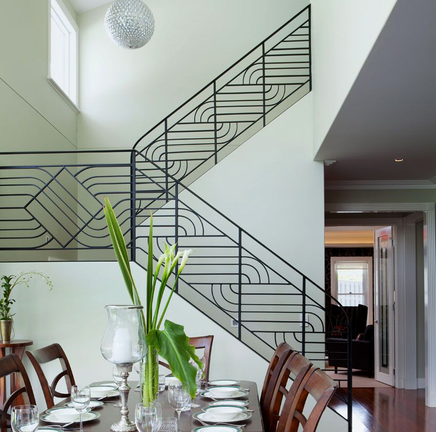 Stairs with wrought iron railings can be installed both inside the house and outside