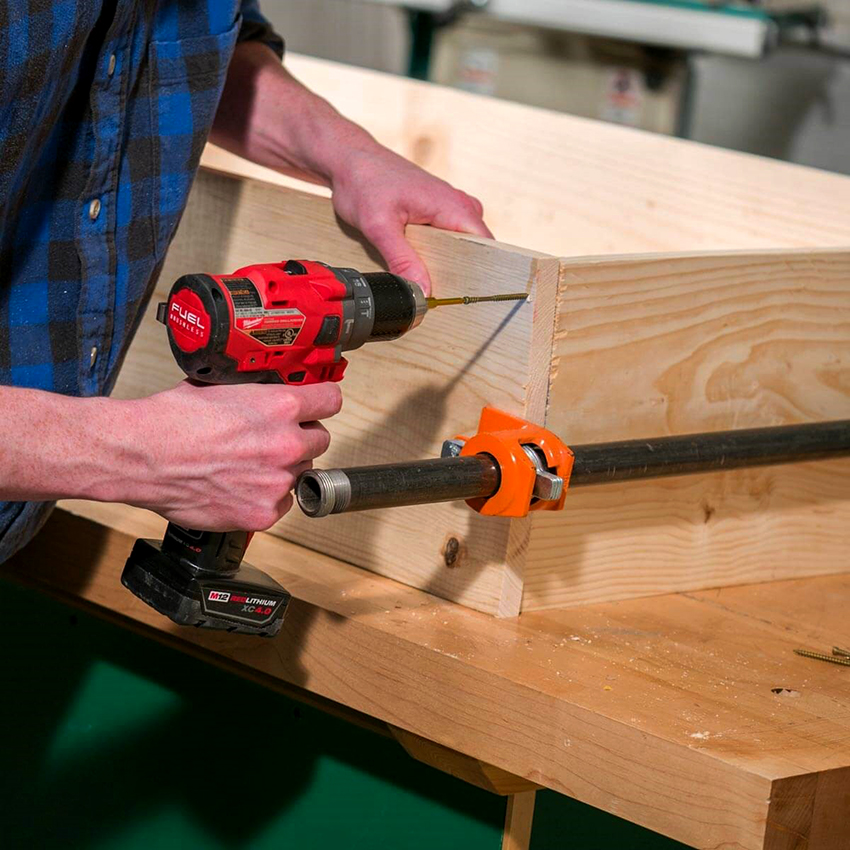 To assemble the base of the workbench, you need to secure the frame and base plate