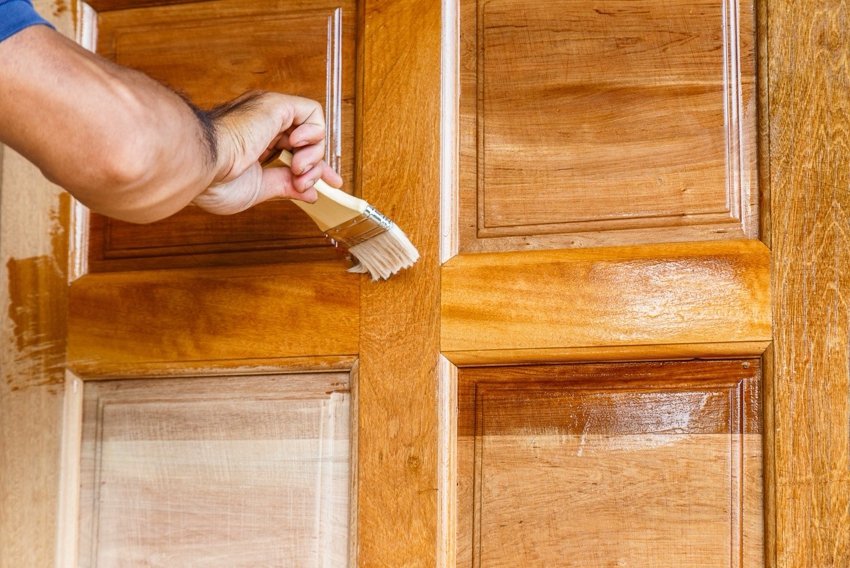 Sometimes sanding and varnishing is enough to renovate an old door.